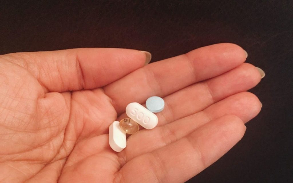 hand holding pills